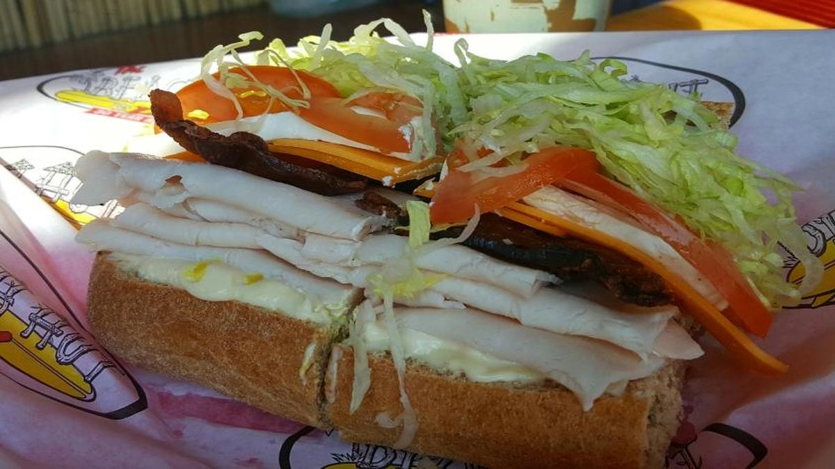 The Beach Comber from Beach Hut Deli is piled high with your two choices of meat and cheese.