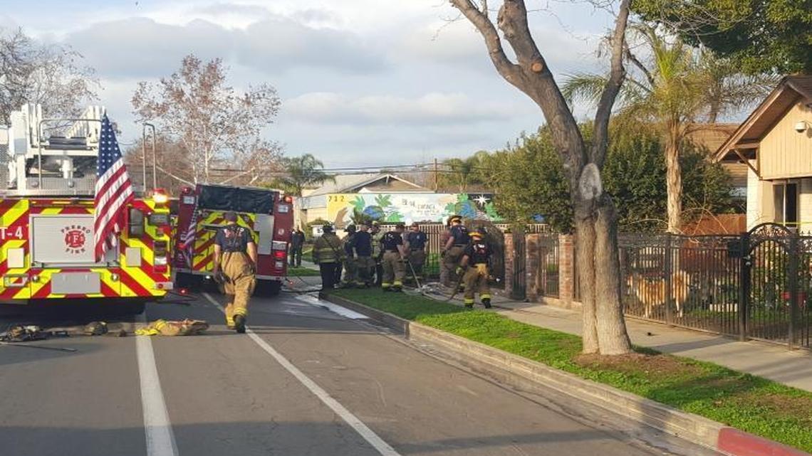 The body of a man with multiple stab wounds was found in a home on Van Ness Avenue on Wednesday, Jan. 20, 2015 as firefighters battled a blaze at the home.
