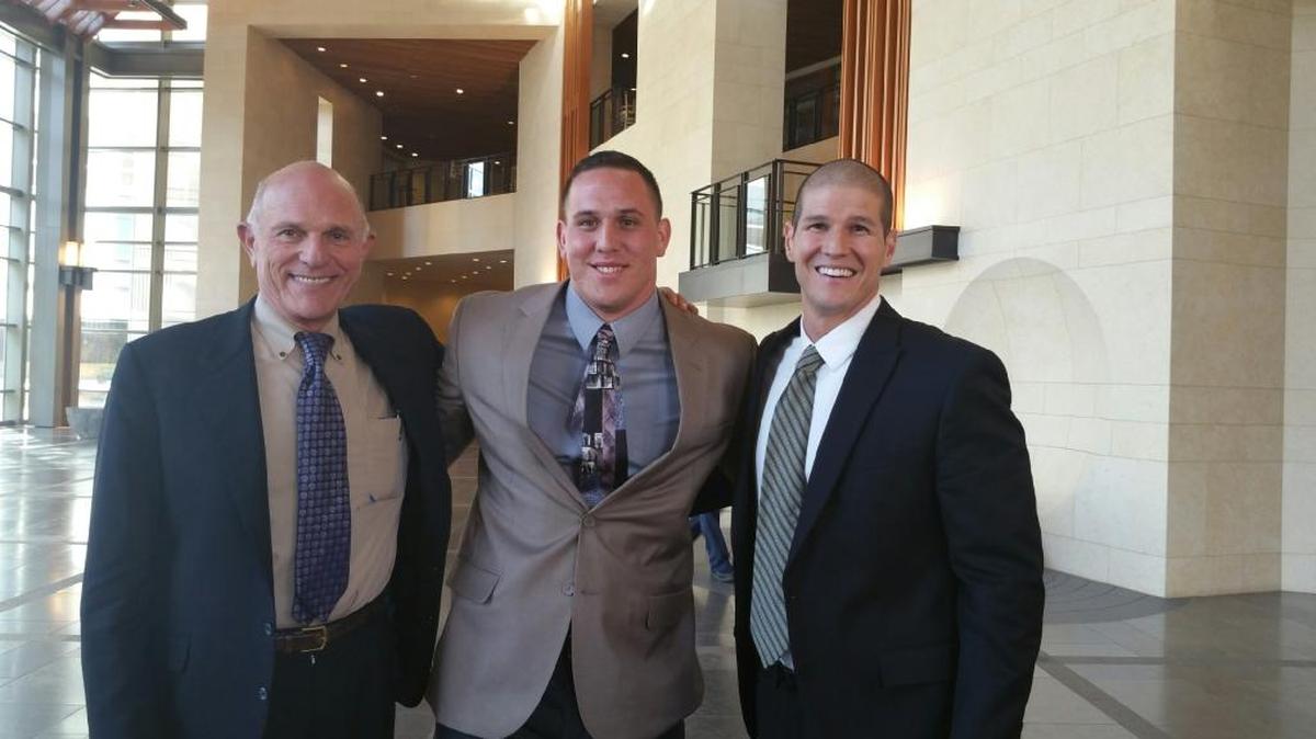 George Macias Jr, center, with his two lawyers, Panos Lagos, left, and Charles Tony Piccuta, after they agreed to accept the city of Clovis’ offer to settle a civil rights lawsuit for $650,000.