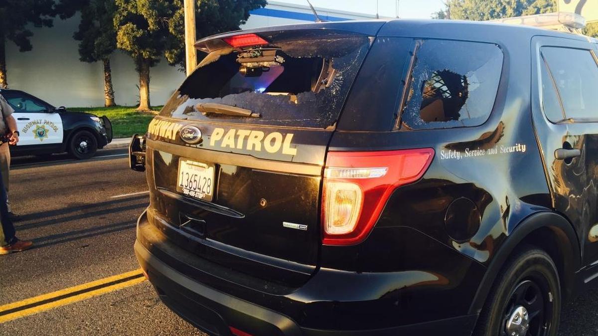 A California Highway Patrol SUV damaged by people in a crowd at a street race “sideshow” Sept. 24 in southwest Fresno.