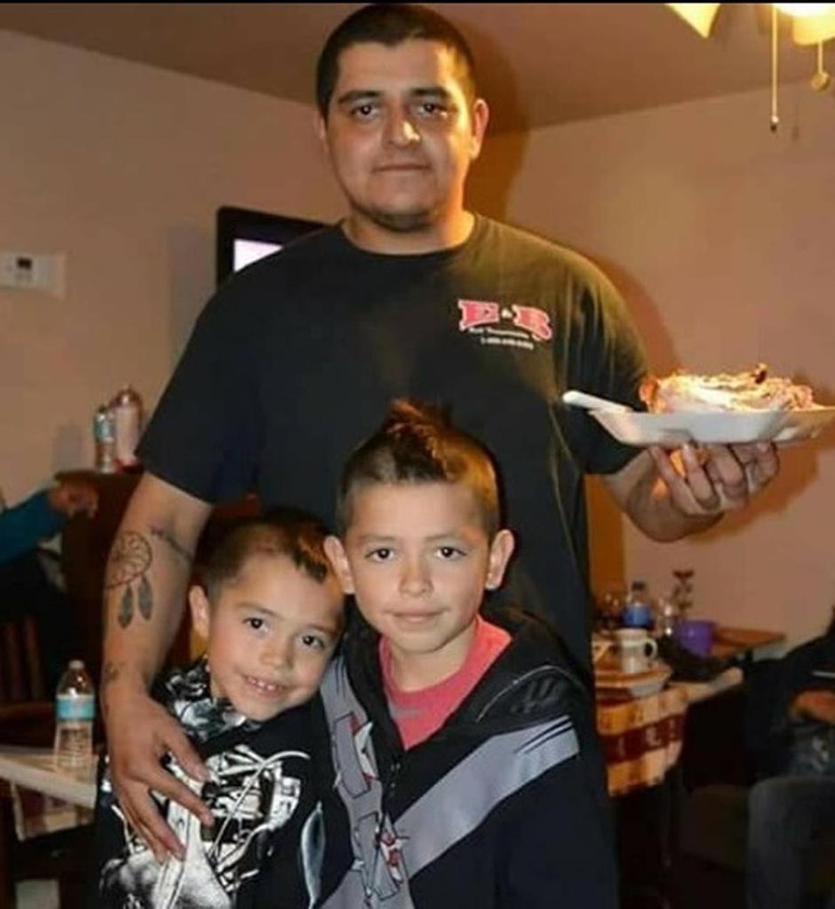 Raymond Romero Jr. with his sons in an undated family photo.