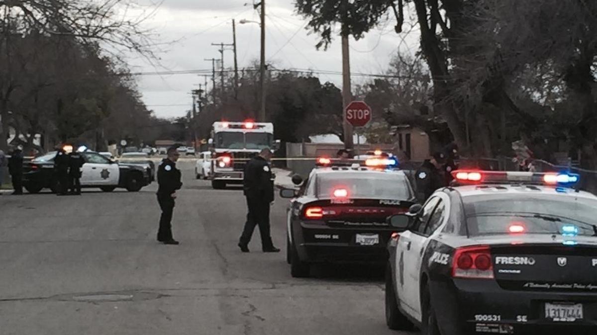 Police cars at the scene of a shooting in southeast Fresno.