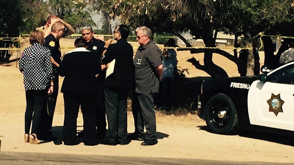 
Fresno County Sheriff Margaret Mims (center, back to camera) confers with Fresno police at the scene of a shooting involving a Fresno police officer Friday morning, Aug. 7. The shooting reportedly occurred at the southwest corner of Shaw and Hayes avenues.
