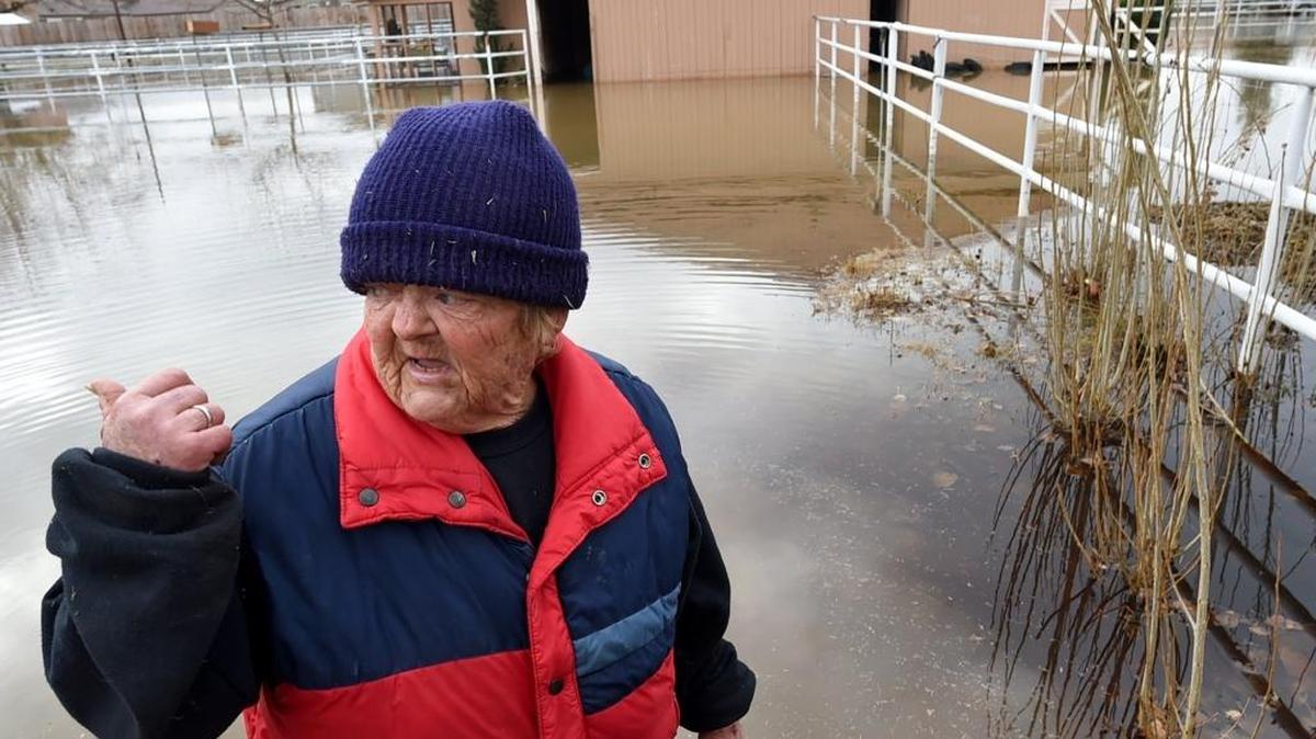 Standing in her flooded pasture and barn, Locan Avenue resident Val Wellerd, 66, talks about the 3 a.m. flooding of the Gould Canal that came over its bank when pumps in place to divert water past culvert construction on Locan were reportedly not turned on the morning of Jan. 10, 2017. Her three horses and one mini-donkey were rescued by Heart of the Horse Ranch.