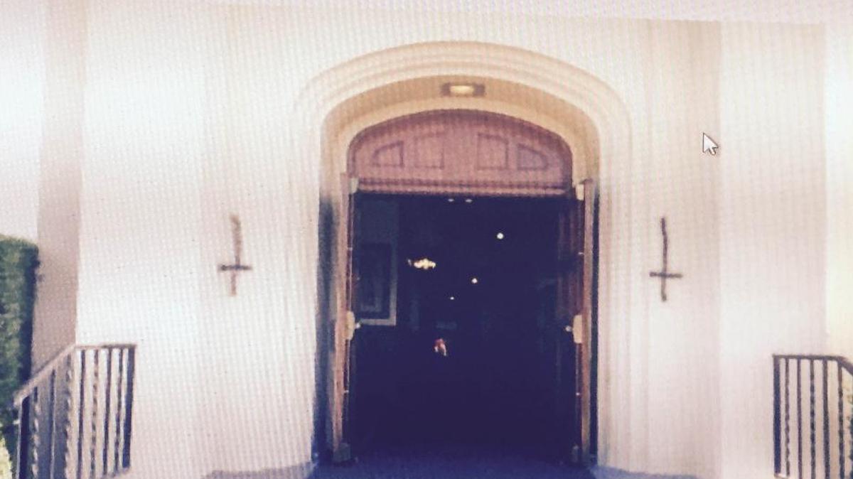Upside-down crosses defaced the front of St. Therese church in Fresno’s Tower District.