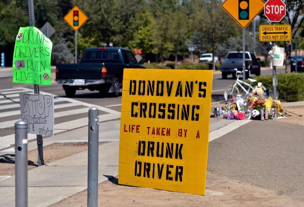 Along Shepherd Avenue in northeast Fresno in 2012, where a sign and flowers marked the area where 7-year-old Donovan Maldonado was killed by Central High School coach Loren LeBeau in July 2012.