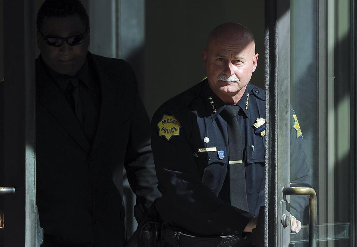Fresno police chief Jerry Dyer, right, leaves the federal court Wednesday in Fresno after testifying in the drug trafficking trial of his former deputy chief, Keith Foster.