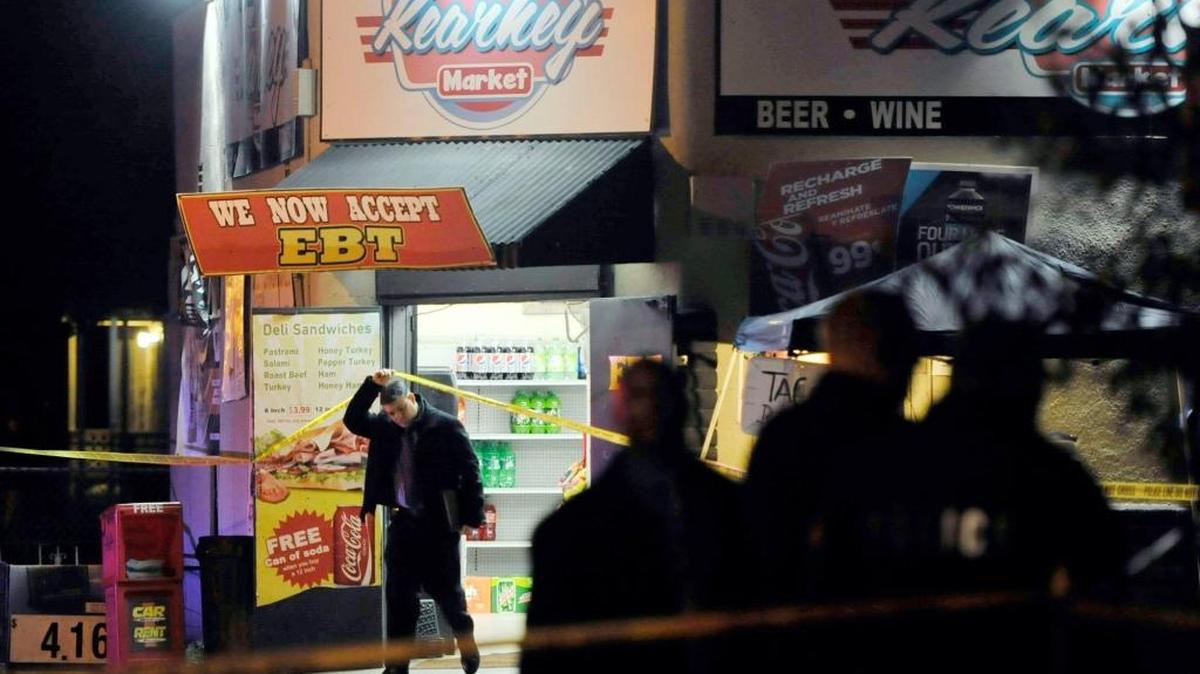 Detectives investigate a homicide in southwest Fresno at the Kearney Market, 147 E. Kearney Blvd. One man was killed Saturday night when an unknown suspect entered the store and opened fire on the victim.