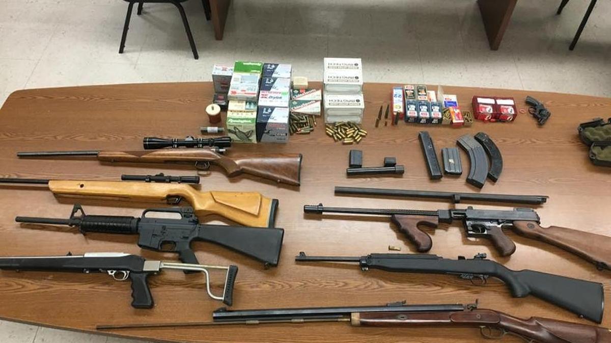 Sanger police seized mulitple firearms, including a semi-automatic version of the Thompson submachine gun, (third from bottom on right), as well as ammunition, while responding to a call concerning a suicidal man.