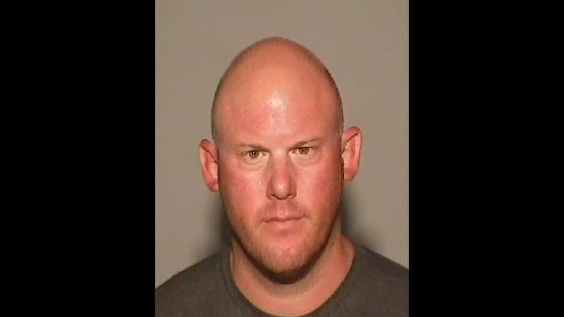 The booking mug of Fresno police officer Brian Heck, who was arrested by the Clovis Police Department on domestic violence charges involving his former girlfriend.