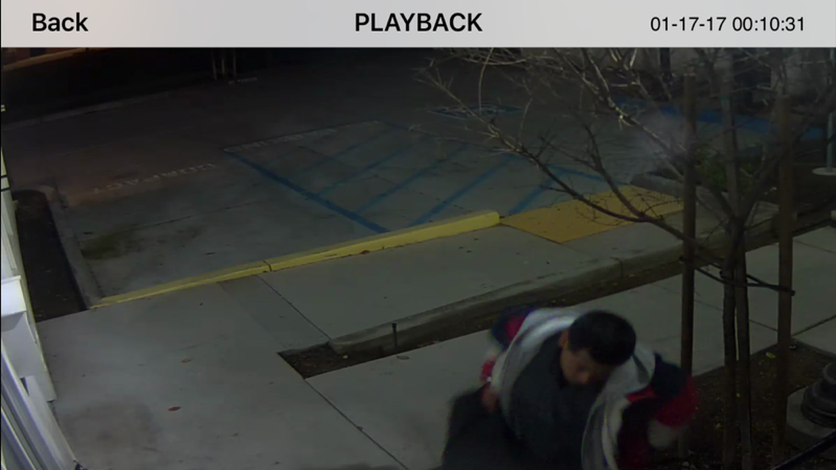 A burglary suspect flees Youth Leadership Institute in downtown Fresno with about $4,000 worth of electronics on Tuesday, Jan. 17, 2017.