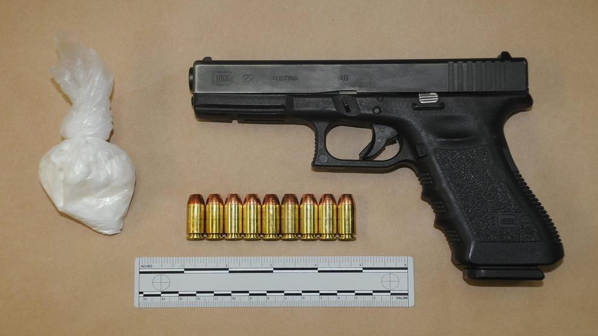 
Police say a Glock .40 caliber pistol and a bag of white powder were seized from a car at Fresno Street and Belmont Avenue on Monday, Oct. 5, 2015.
