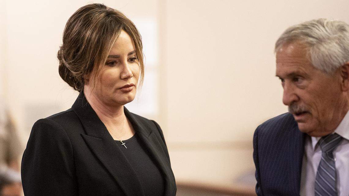 Lori Rossi Gallo, left, turns to leave the courtroom with attorney Peter Jones, right, after appearing in front of Merced County Superior Court Judge Carol Ash in Merced, Calif., on Thursday, Nov. 17, 2022. Gallo was arrested on suspicion of DUI in January, after allegedly driving a Maserati on G Street at about 125 mph and crashing into multiple vehicles.