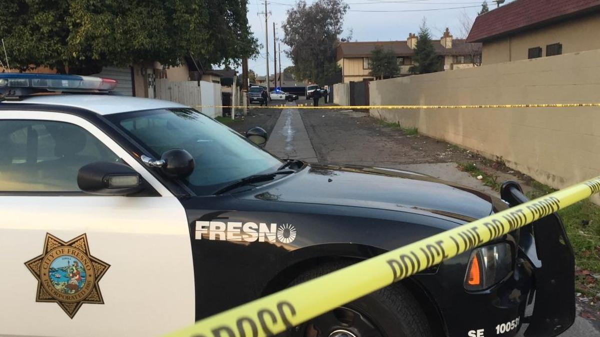 Fresno police investigate an alleyway shooting on Sunday afternoon, Dec. 20, 2015.