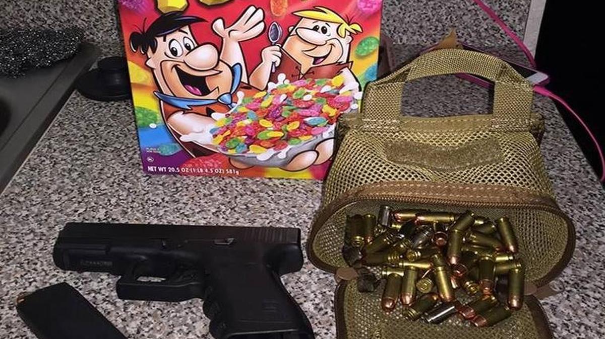 
Police say the Glock handgun was hidden in a box of Fruity Pebbles cereal.
