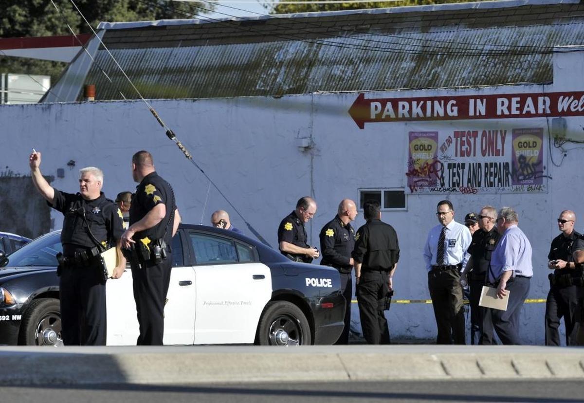 In this Bee file photo, police gather in a parking lot following an officer-involved shooting along Blackstone Avenue between Vassar and Yale avenues Wednesday afternoon, March 23, 2016, in Fresno. Raymond Gonzalez was killed in the incident.