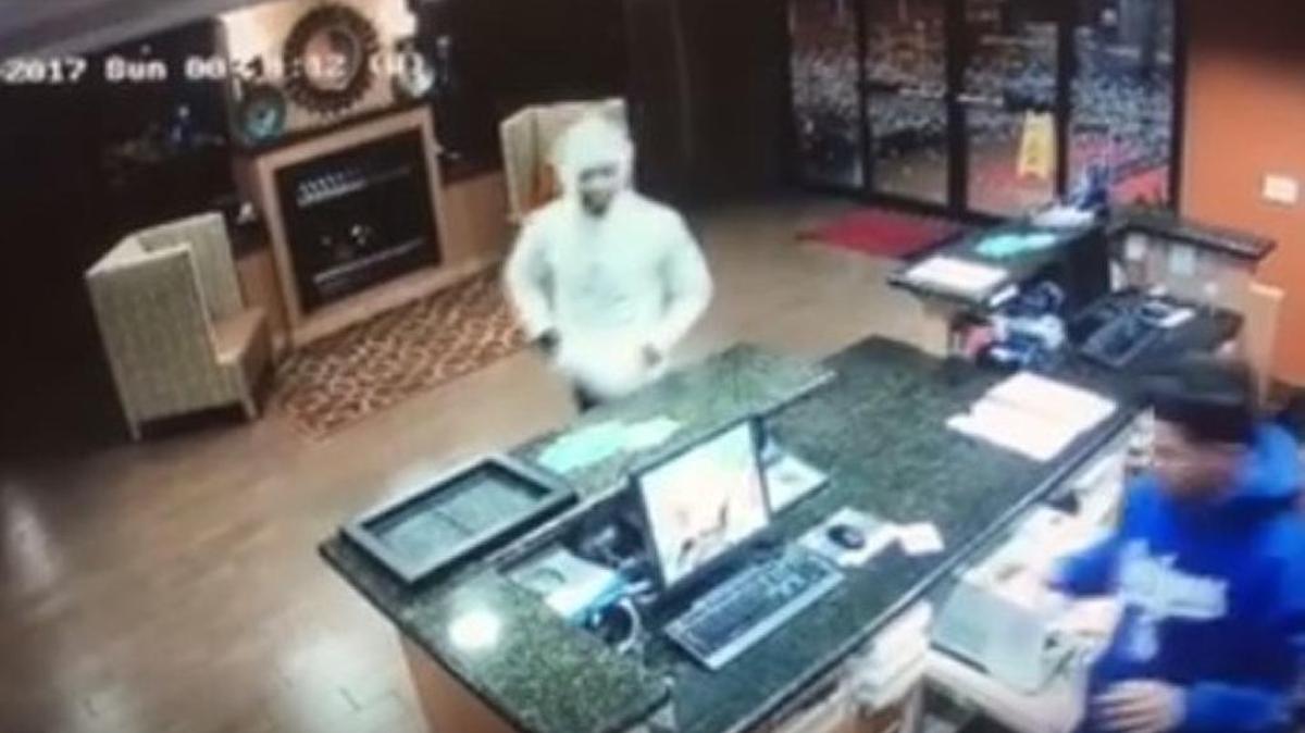 This screenshot from a surveillance camera video shows a man accused of holding up the Hampton Inn and Suites in Madera on Sunday, Jan. 8, 2017.