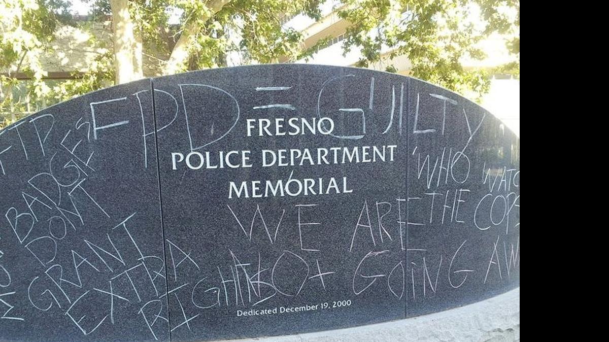 
The Fresno Police Department memorial after it was marked with chalk
