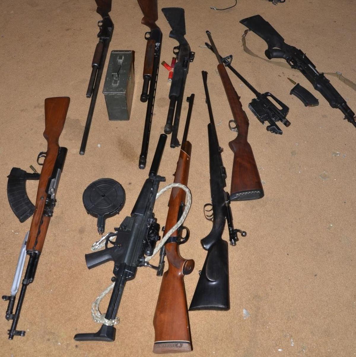 Fresno County Sheriff’s deputies found 18 weapons inside a home in Prather, California where a wanted felon had also been growing marijuana.