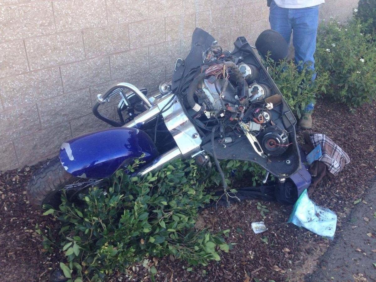 A broken Harley-Davidson sits after its driver allegedly struck three bicycle riders along northbound Auberry Road on July 25. The California Highway Patrol said the driver of the motorcycle was suspected to be under the influence of alcohol.