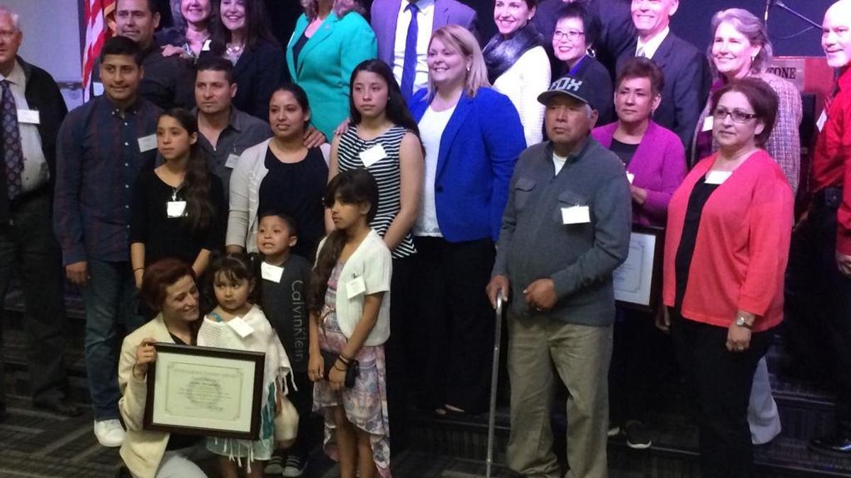 Fresno County District Attorney Lisa Smittcamp, in teal jacket, joins honorees at the Rotary Club of Fresno luncheon honoring unsung heroes of the criminal justice system – the witnesses and prosecutors and staff who hold criminals accountable.
