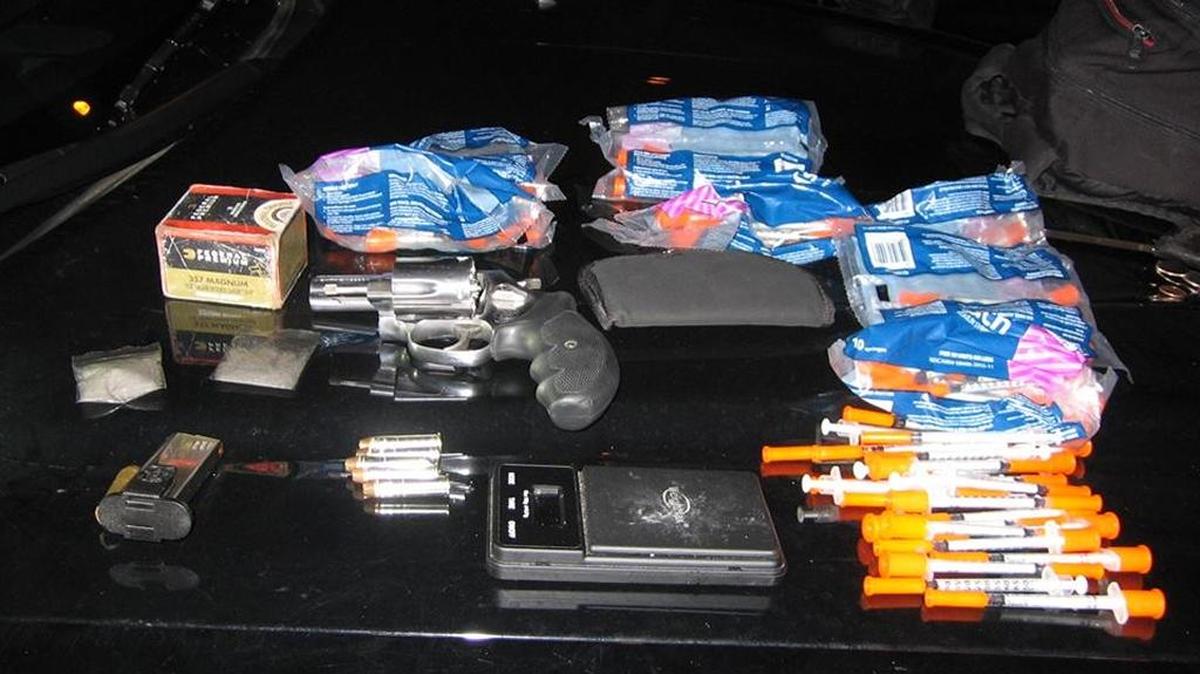 A handgun, methamphetamine, needles and ammuntion seized after Fresno traffic stop.