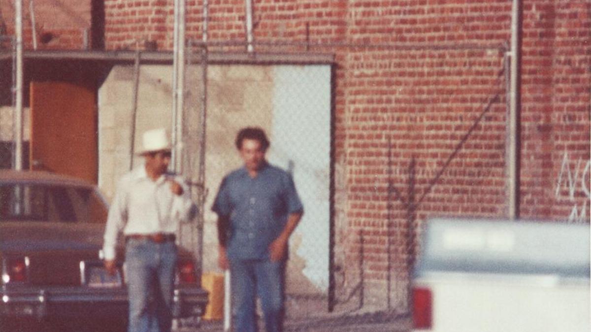 Fresno police officer Pete Santellano and DEA agent “Kiki” Camarena walk out of La Flor de Mexico in Fresno’s Chinatown after making a heroin buy in this 1974 photo taken from an undercover surveillance van.