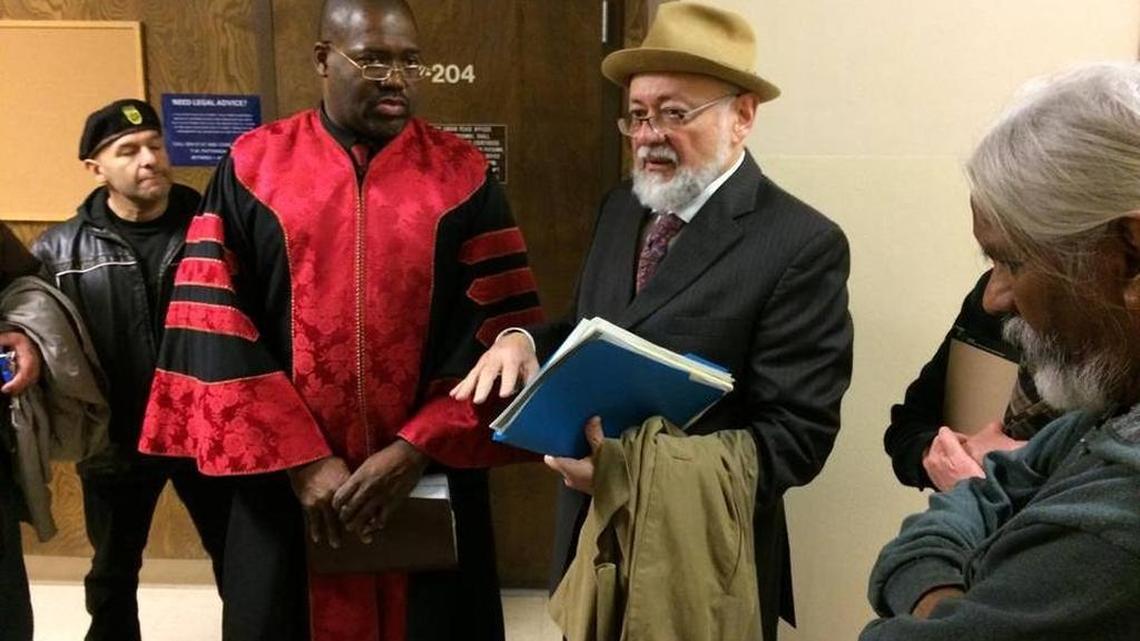 In this photograph from January 2016, the Rev. Floyd Harris Jr., in a red robe, stands next to his attorney, Robert Navarro, after he pleaded not guilty in Fresno County Superior Court to misdemeanor charges of obstructing traffic and participating or sponsoring an anti-police rally in downtown Fresno without a permit. On Tuesday, Jan. 17, 2017, a judge dismissed the case against Harris after he stayed out of trouble for one year.