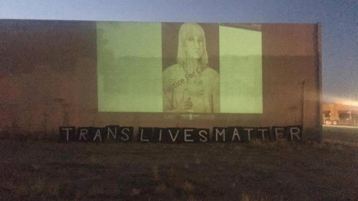 A sketched photo of Casey “K.C.” Haggard is projected onto a wall above the message “Trans Lives Matter” during a vigil in central Fresno on Saturday, July 22, 2017, as the two-year anniversary of her unsolved slaying neared.