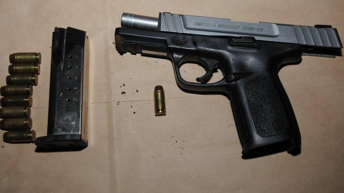 Police found a Smith & Wesson pistol discarded by a man who ran from officers.