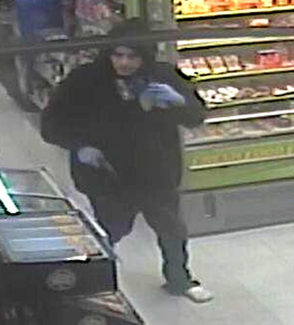 An image from security video shows one of the two men who robbed a Madera County gas station and mini-mart Monday, Nov. 13, 2017. The store clerk was shot and killed during the robbery.