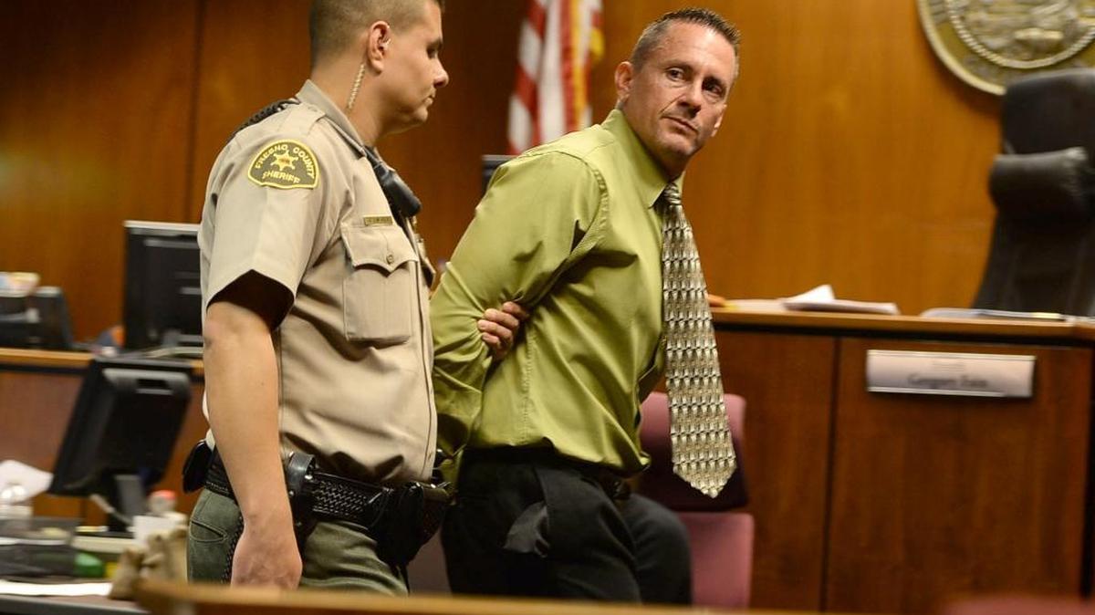 Former Central High basketball coach Loren LeBeau is led from the courtroom after being sentenced to 12 years in prison for killing 7-year-old bicyclist Donovan Maldonado in a hit-and-run, drunken driving collision in July 2012.