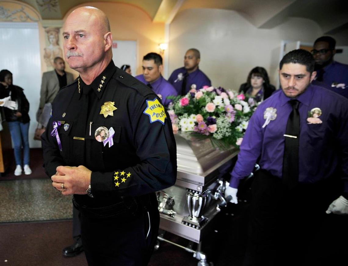 Fresno Police Chief Jerry Dyer walks in front of the pallbearers and the casket during the memorial service for Janessa Danielle Ramirez held at Cornerstone Church in January 2015. Janessa, 9, was killed by a stray round fired in a gang clash as she stood with her mother outside a laundromat.