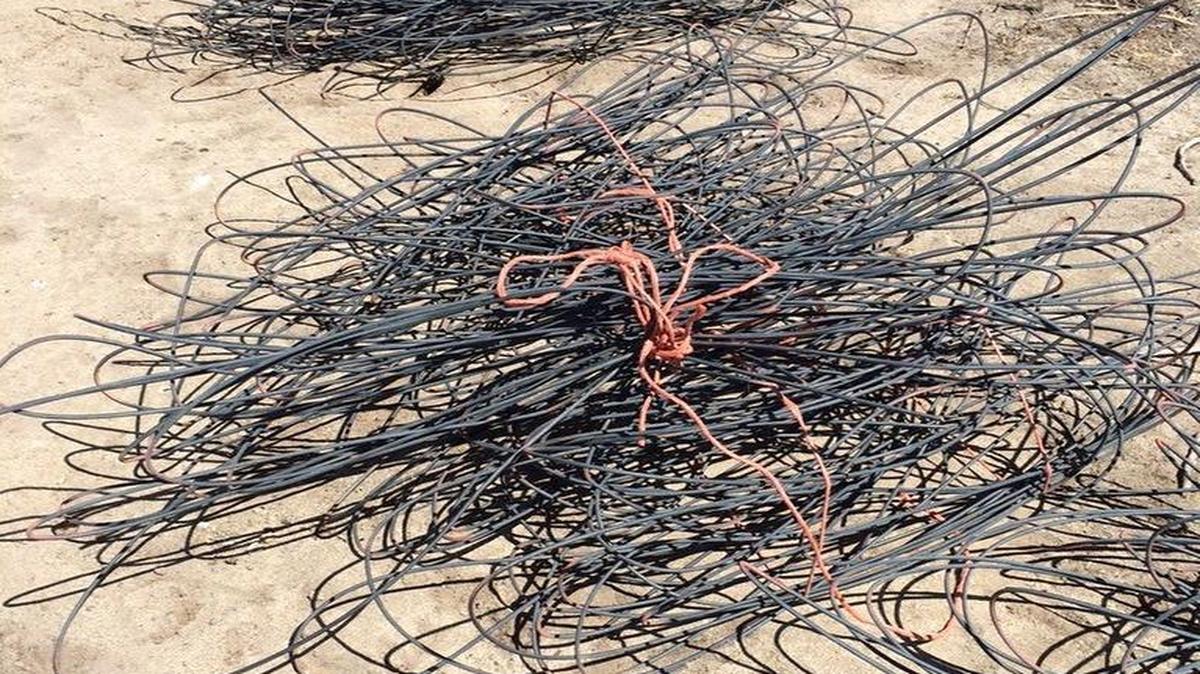
Wire insulation left behind after thieves cut down power poles and stole copper wire near Coalinga. 
