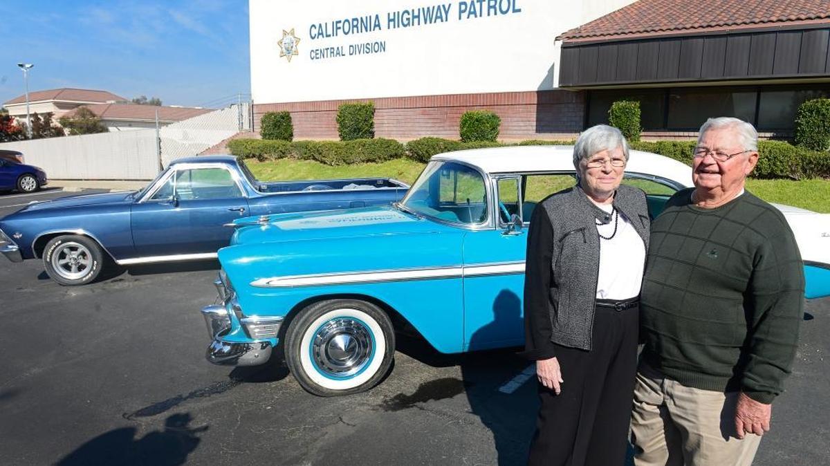 Faith and Don Klein stand by their 1956 Chevy Bel Air and 1966 El Camino following a news conference at the California Highway Patrol Central Division office in Fresno on Nov. 22, 2015. The Kleins’ cars had been stolen but were recovered.