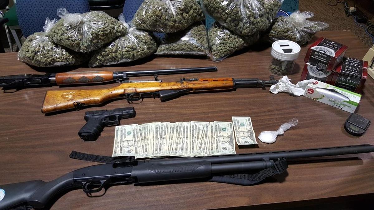 Firearms and drugs seized by police Wednesday night in southeast Fresno.