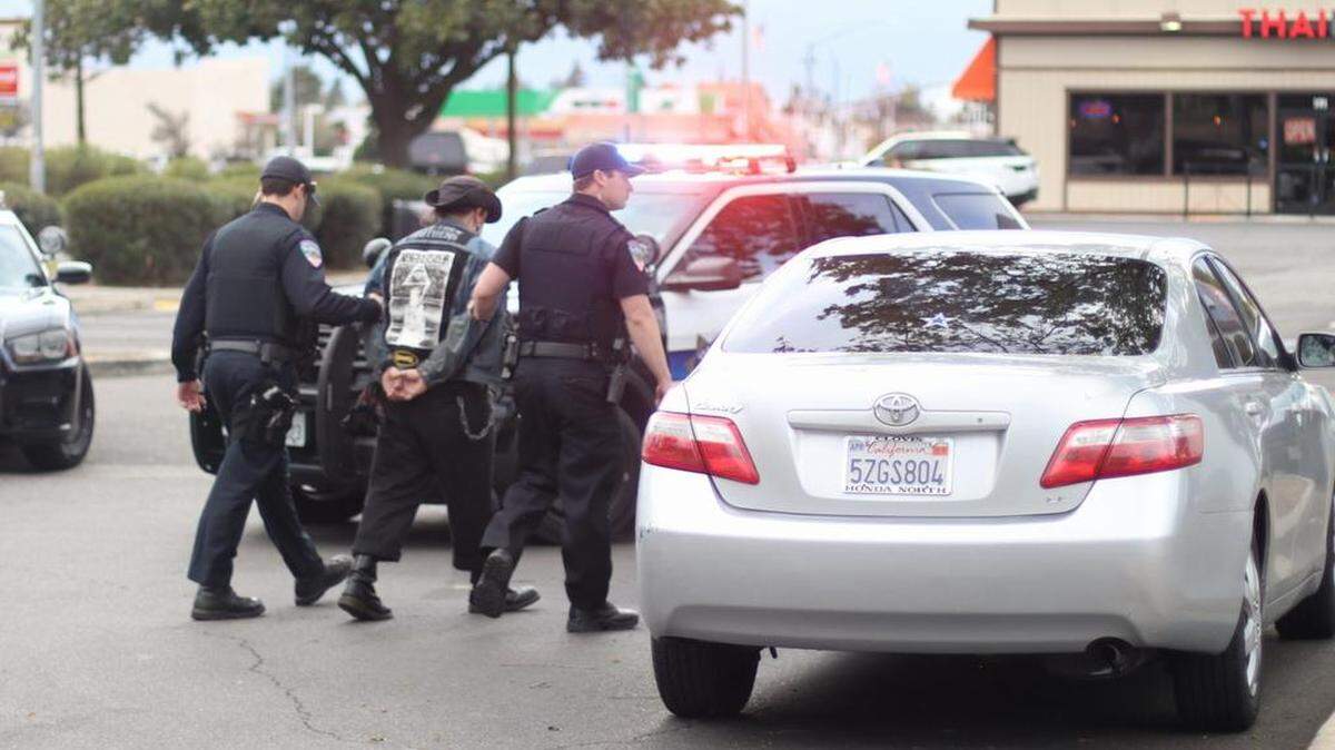 A man is taken into custody March 17, 2018 by Clovis police officers. The police department reported a large disturbance at the MB2 Raceway at the Sierra Vista Mall.