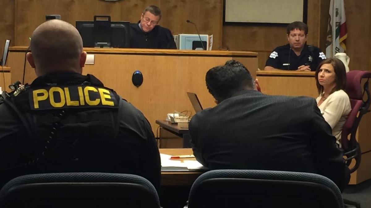 Judge W. Kent Hamlin takes notes Tuesday in Fresno County Superior Court as Fresno police officer David Ponek testifies about the December 2013 shooting of Edison High teacher Steven Guerrero. At far right is court reporter Noelle Acosta. Police Sgt. Justin Hoagland, left, and prosecutor Galen Rutiaga, right, are also pictured.