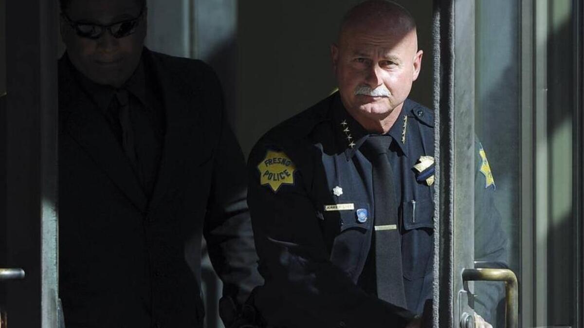 Fresno police chief Jerry Dyer, right, leaves the federal courthouse in Fresno after testifying in the drug trafficking trial against his former deputy chief, Keith Foster.
