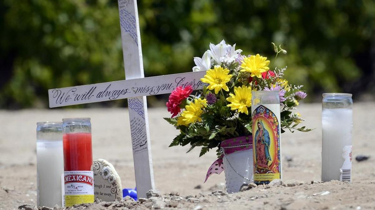 
A memorial, including a cross with an inscription to “George Jr.,” at the site near Biola where George Salwasser Jr. was shot and killed in May 2014. Sheriff’s investigators say Salwasser, 38, a farmer, was checking on a report of suspicious activity when he happened upon four people trying to remove the wheels from a stolen pickup.
