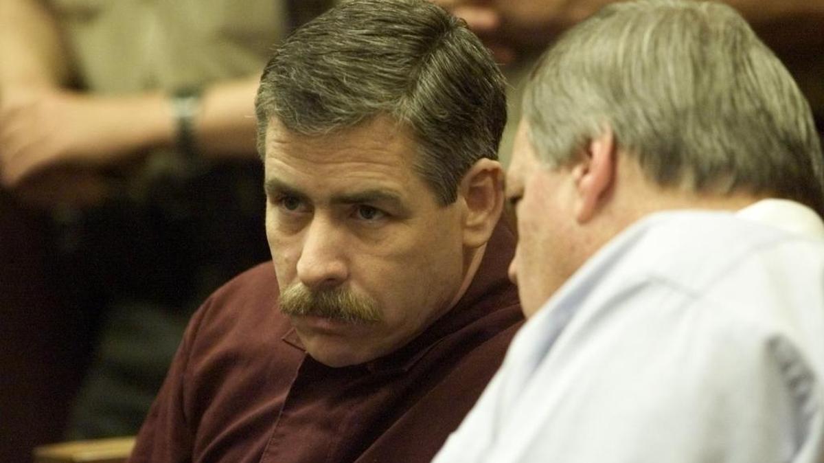 Former Fresno police officer Paul Hurth, accused of murdering his lover’s husband, during court appearance in March 2000 with attorney Ernest McKinney.