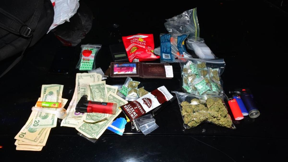 Packaged marijuana seized from a man police say was jaywalking on First Street near Tulare Street early Monday in southeast Fresno.