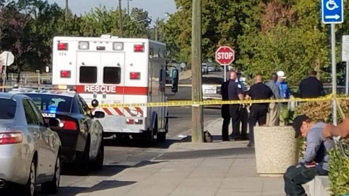 Police and emergency workers gather where a homeless man was found dead in Pinedale on Friday, Oct. 6, 2017.