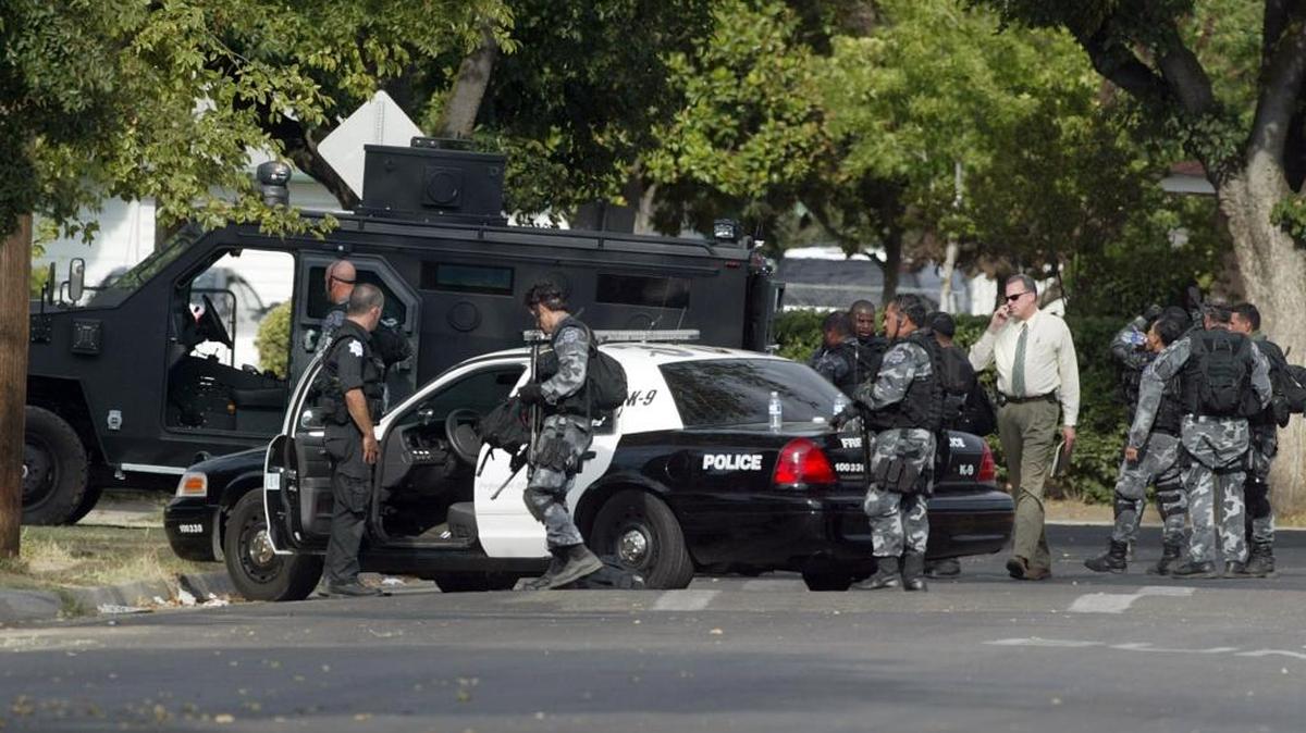 The Dog Pound gang’s turf in southwest Fresno is generally bounded by Jensen, Annadale and Elm avenues and Martin Luther King Jr. Boulevard and has been the scene of many police actions. In this August 2007 scene, officers wrap up a standoff in “The Pound” following the arrest of a 20-year-old Dog Pound member wanted in connection with the robbery and shooting of two women. The gang member, Tyrone Cowan, was found guilty in 2013 of murder and sentenced to life in prison without the possibility of parole.
