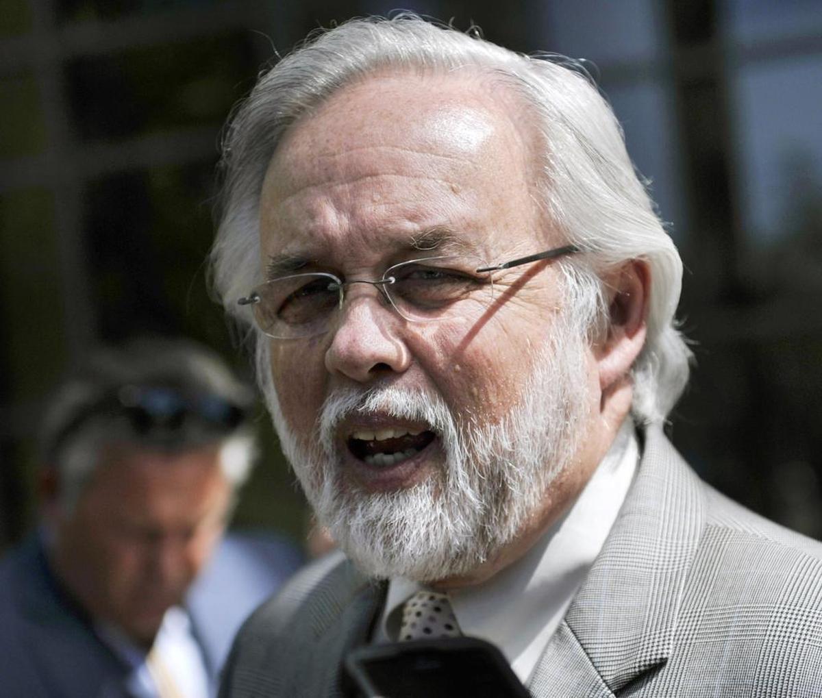 In this March 2015 photograph, Fresno defense attorney E. Marshall Hodgkins talks to the media outside the federal courthouse about the arrest of former deputy police chief Keith Foster after his arrest on drug trafficking charges.