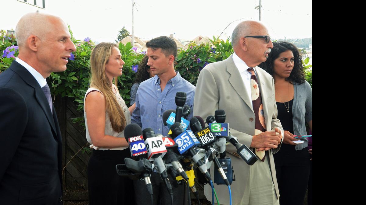 
Denise Huskins and her boyfriend, Aaron Quinn, turn to each other at the end of a news conference on Monday in Vallejo. At left is Huskins’ attorney, Douglas Rappaport, and second from right is Quinn’s attorney, Daniel Russo. The lawyers for a couple in a kidnap-for-ransom case that police called a hoax are blasting investigators and asking that authorities set the record straight. Russo said Vallejo police detectives rushed to judgment and that he and Rappaport want the public perception of their clients changed. 
