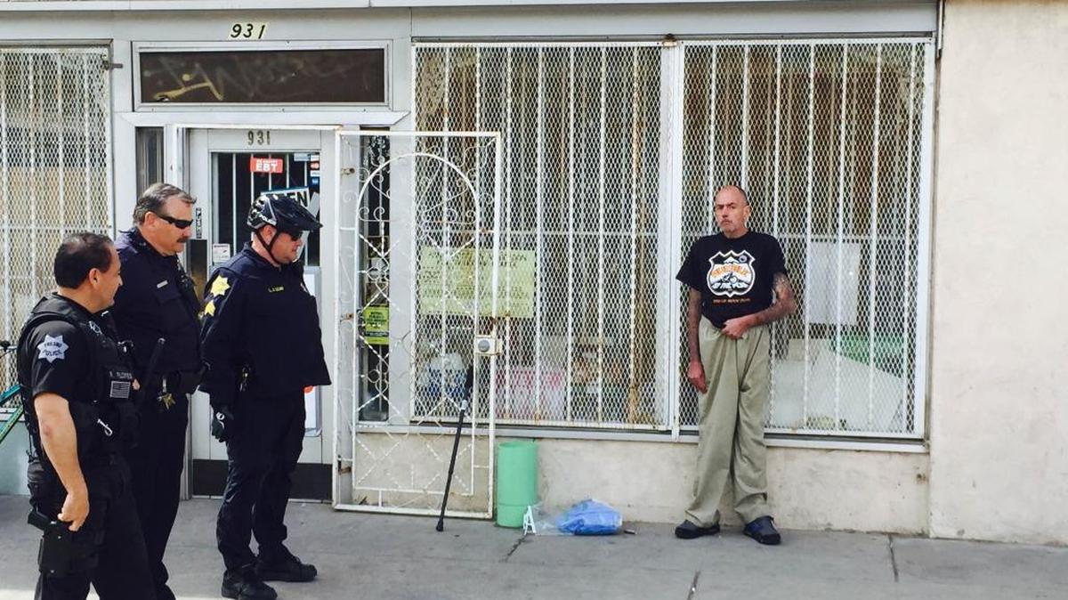 Police surround a man identified as James Kelsey after a Union Bank in Chinatown was robbed.