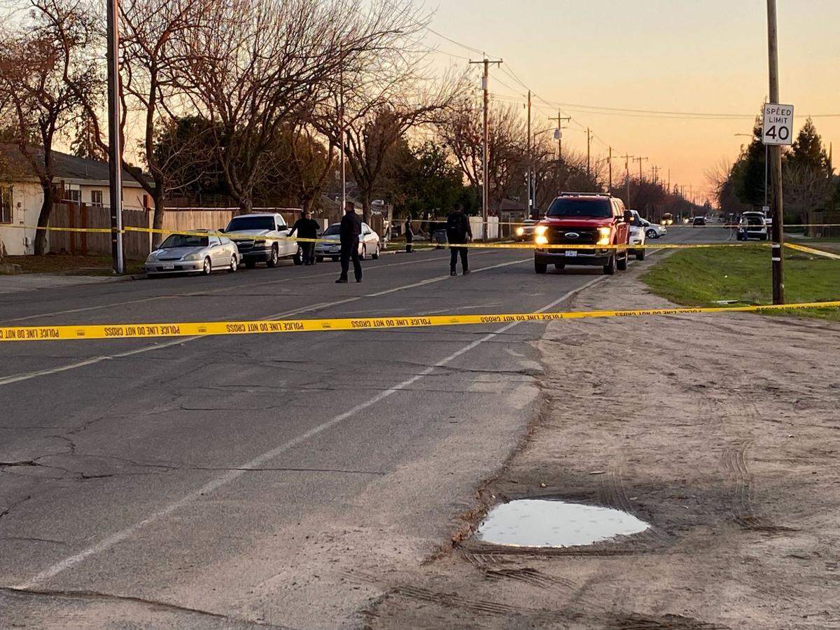 Investigators come the crime scene west of Highway 99 where the body of a pregnant woman, who had been set afire, was discovered.