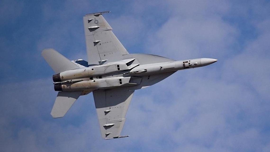 An F/A-18 fighter jet in flight.