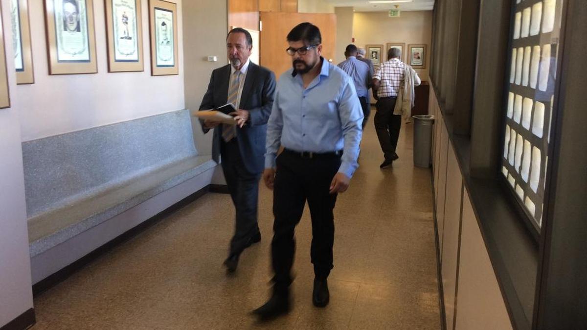 In this photograph from March 2017, Noe Jimenez, right, walks out of a courtroom with attorney Daniel Bacon. Jimenez, 50, of Fresno is among eight people charged with stealing from the estates of dead people in Fresno County.